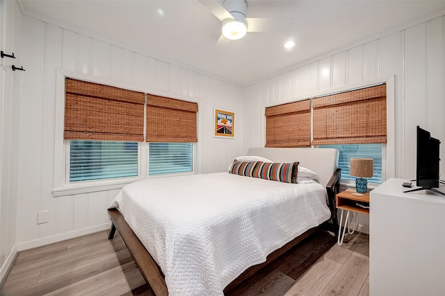 bedroom featuring light hardwood / wood-style floors and ceiling fan