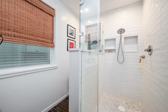 bathroom with a tile shower