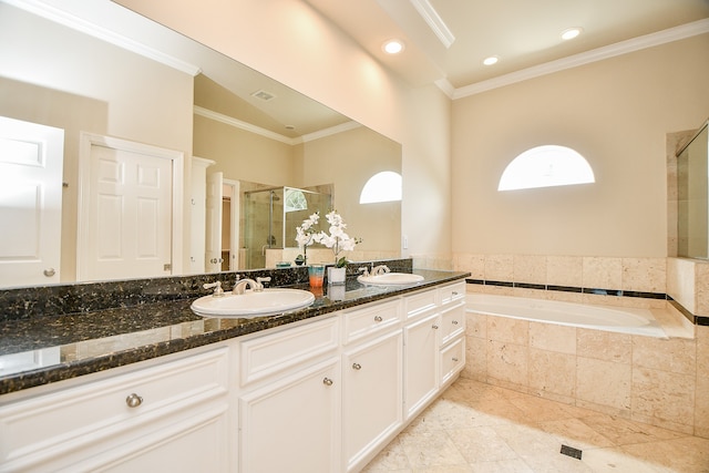 bathroom with vanity, shower with separate bathtub, and ornamental molding