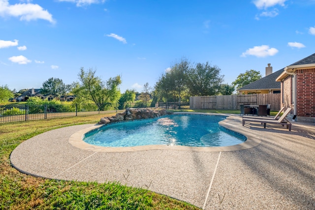 view of pool featuring pool water feature and a patio