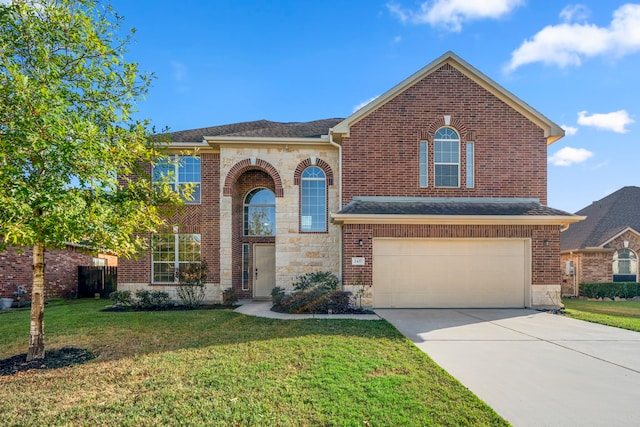 front of property featuring a front yard and a garage