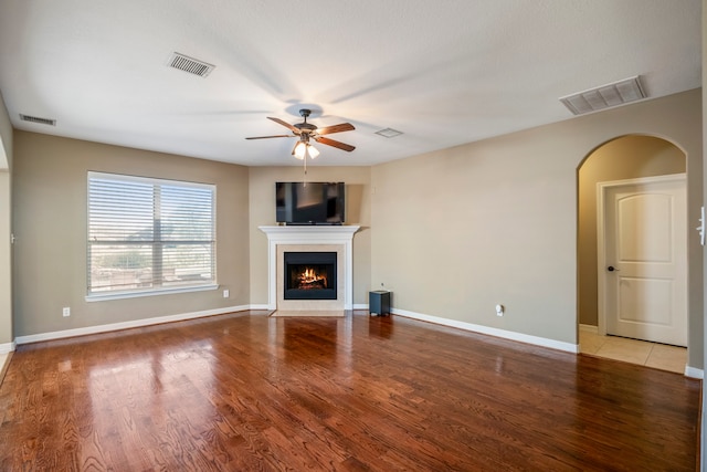 unfurnished living room with light hardwood / wood-style floors and ceiling fan