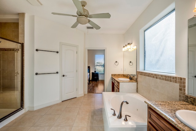 bathroom with vanity, shower with separate bathtub, and plenty of natural light