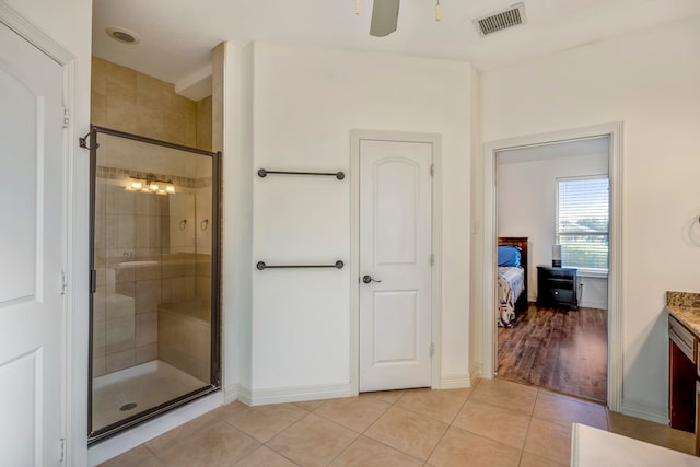 bathroom featuring vanity, ceiling fan, walk in shower, and wood-type flooring