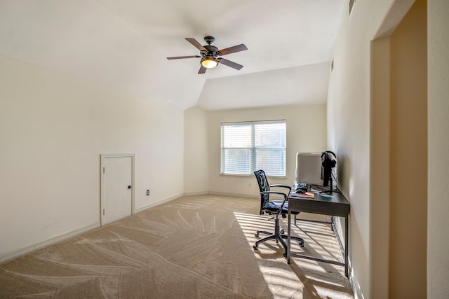 office featuring ceiling fan, lofted ceiling, and light colored carpet