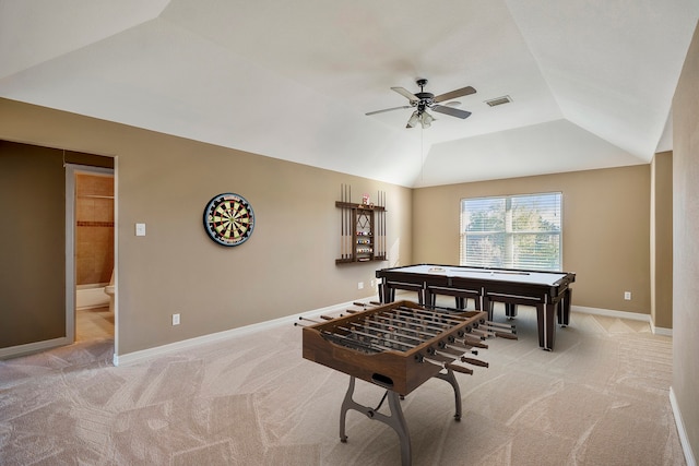 recreation room featuring ceiling fan, vaulted ceiling, and light colored carpet