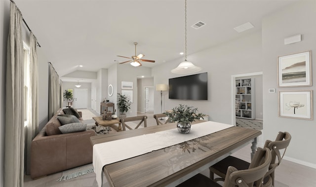 dining room with light hardwood / wood-style floors and ceiling fan