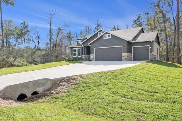 craftsman-style house featuring a garage and a front lawn