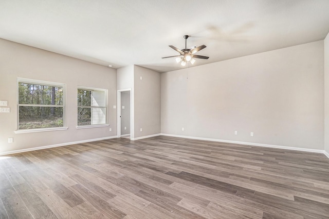 spare room featuring ceiling fan and hardwood / wood-style flooring