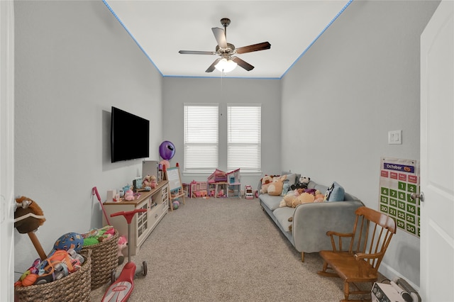 playroom with carpet and ceiling fan