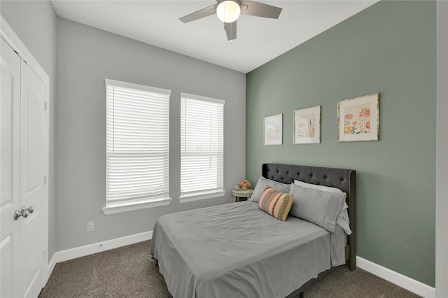 bedroom with a closet, ceiling fan, carpet, and multiple windows