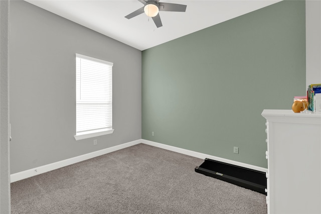 carpeted empty room with ceiling fan