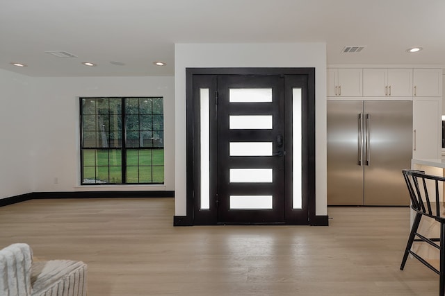 foyer with light hardwood / wood-style floors