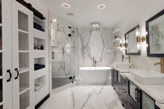 bathroom with vanity, independent shower and bath, and built in shelves