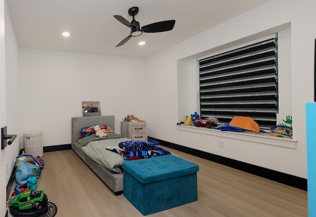 bedroom featuring ceiling fan and wood-type flooring