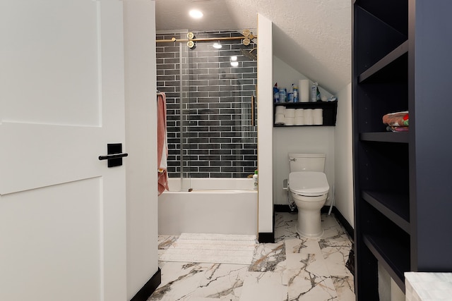 bathroom with tiled shower / bath, a textured ceiling, and toilet