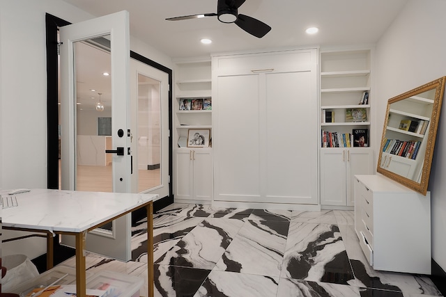 office featuring built in features and ceiling fan