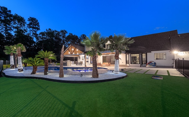 view of pool featuring a patio area and a yard