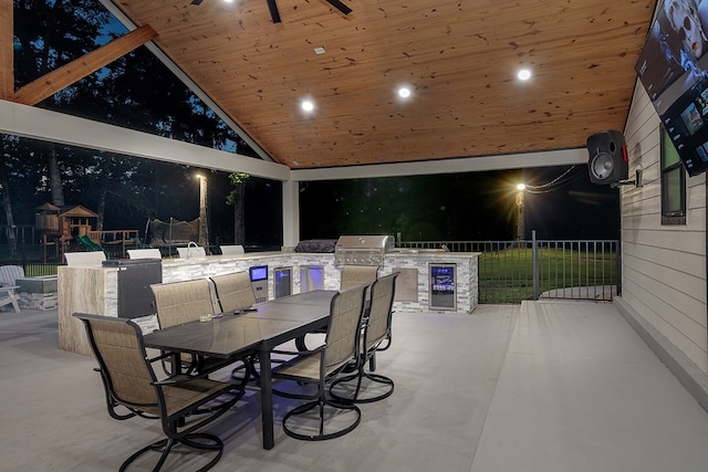 patio at night featuring grilling area and area for grilling