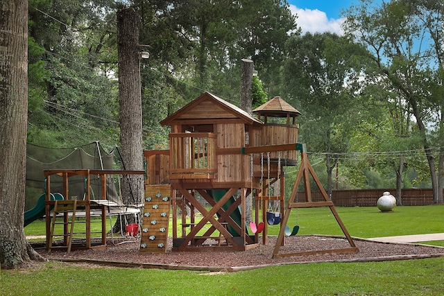 view of playground with a lawn