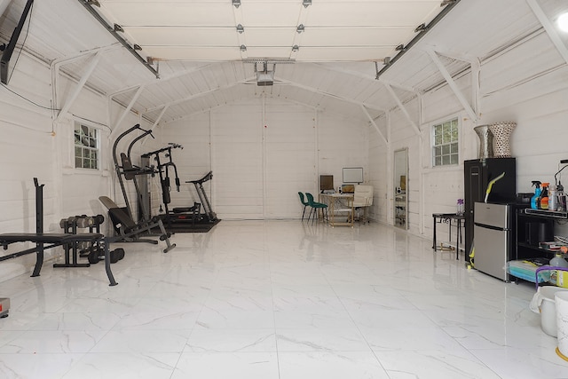 garage featuring stainless steel fridge