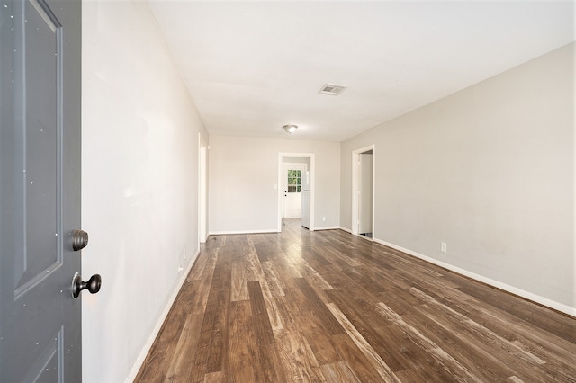 spare room featuring dark hardwood / wood-style floors