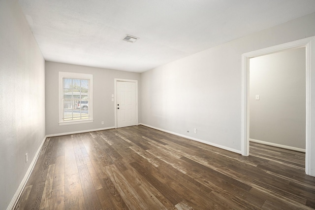 10406 Wiggins St, Houston, TX 77029 - spare room with dark wood-style floors and baseboards