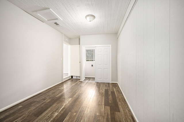 10406 Wiggins St, Houston, TX 77029 - empty room featuring dark wood-style floors, attic access, and baseboards