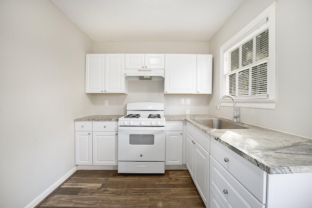 10406 Wiggins St, Houston, TX 77029 - kitchen featuring gas range gas stove, a sink, under cabinet range hood, dark wood-style flooring, and white cabinets