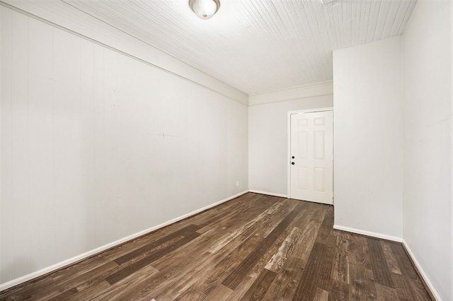 unfurnished room featuring dark wood-type flooring