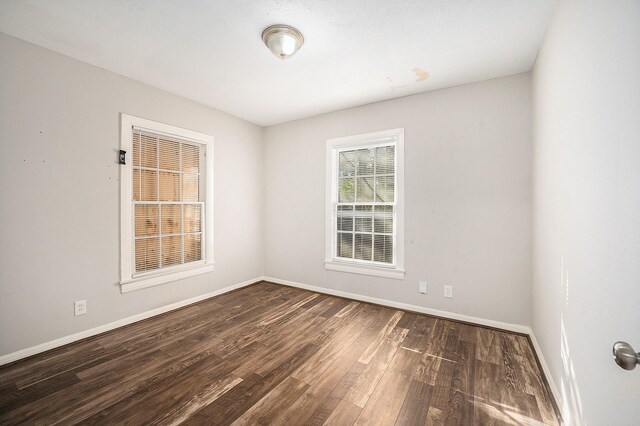 10406 Wiggins St, Houston, TX 77029 - empty room featuring wood finished floors and baseboards