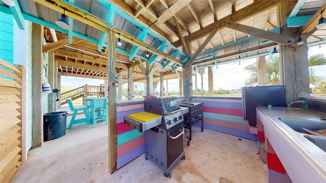 view of patio with area for grilling and sink