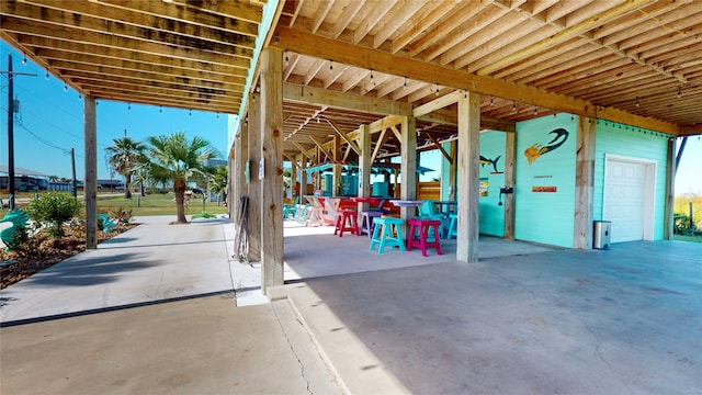 view of patio / terrace featuring a garage