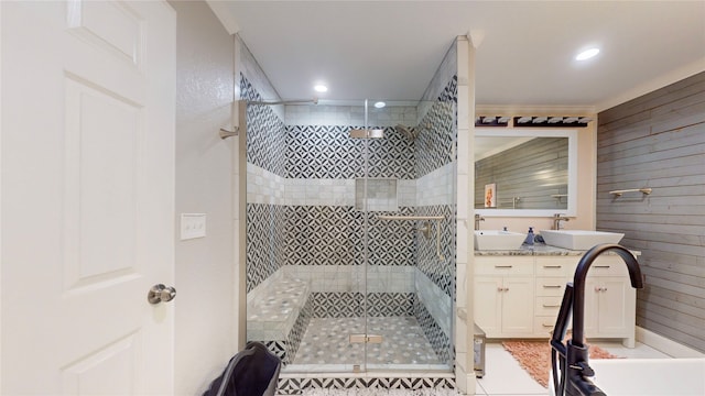 bathroom with vanity, a shower with shower door, and tile patterned flooring