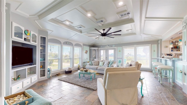 living room featuring coffered ceiling, plenty of natural light, and ceiling fan