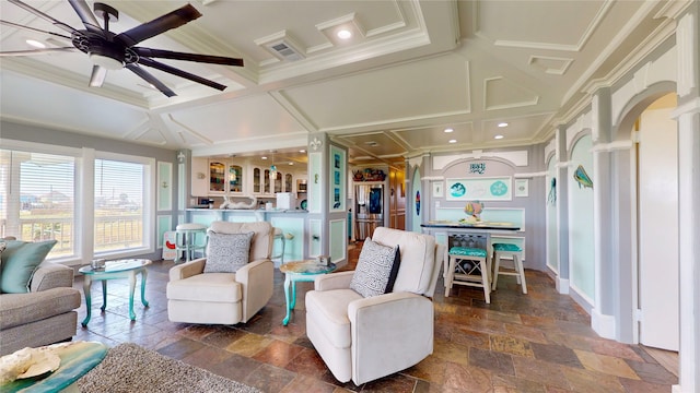 living room featuring ceiling fan, coffered ceiling, and ornamental molding