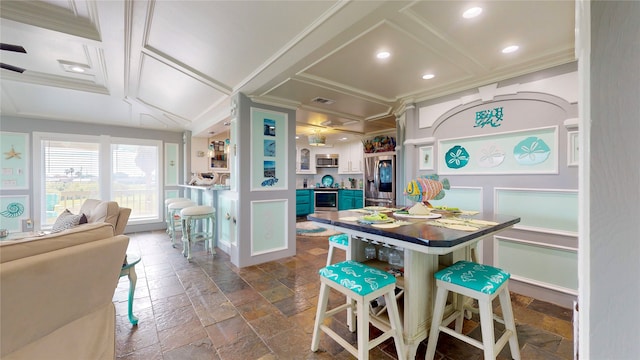 interior space featuring blue cabinets, crown molding, a kitchen bar, and coffered ceiling