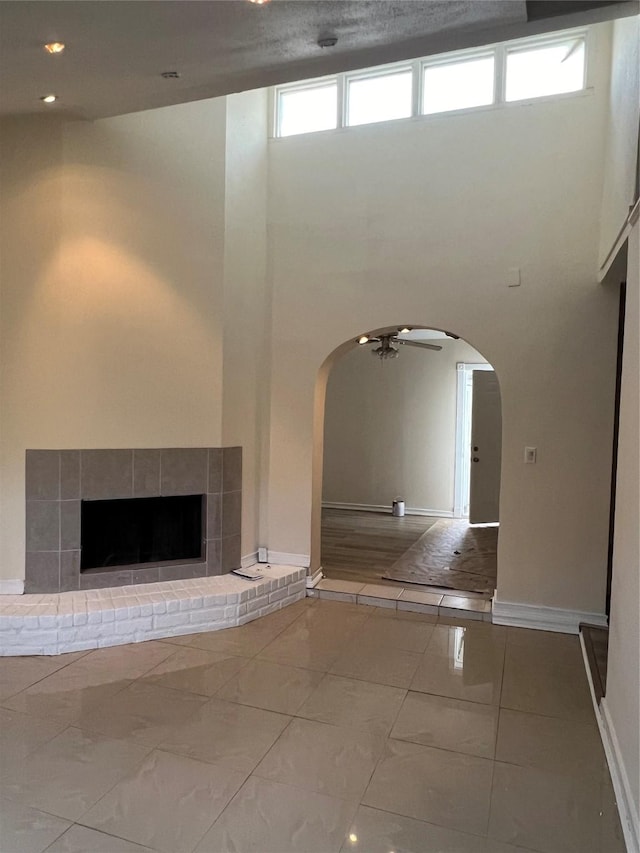 unfurnished living room featuring ceiling fan