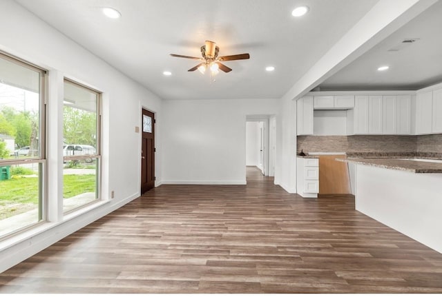 kitchen with ceiling fan, wood-type flooring, a healthy amount of sunlight, and white cabinetry