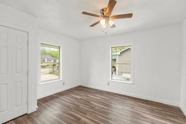 unfurnished room featuring dark hardwood / wood-style flooring and ceiling fan