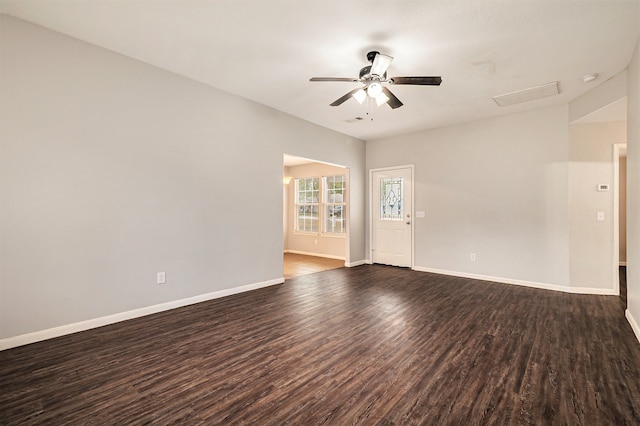 unfurnished room featuring dark hardwood / wood-style floors and ceiling fan