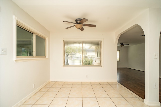 spare room featuring ceiling fan and light hardwood / wood-style flooring