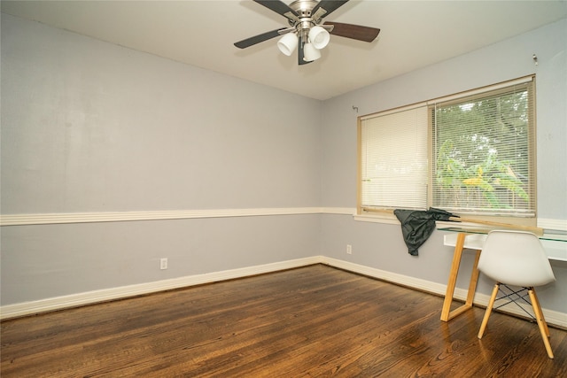 unfurnished office with dark hardwood / wood-style flooring and ceiling fan