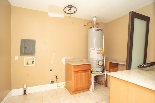 laundry room featuring washer hookup, gas water heater, gas dryer hookup, electric panel, and light tile patterned flooring