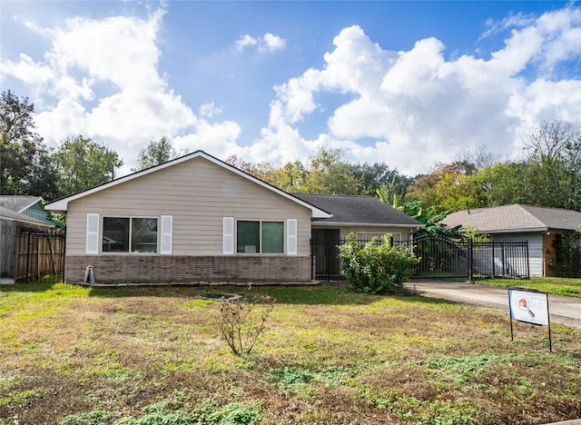 ranch-style house with a front yard