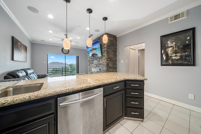 kitchen featuring pendant lighting, dishwasher, crown molding, light tile patterned floors, and light stone counters