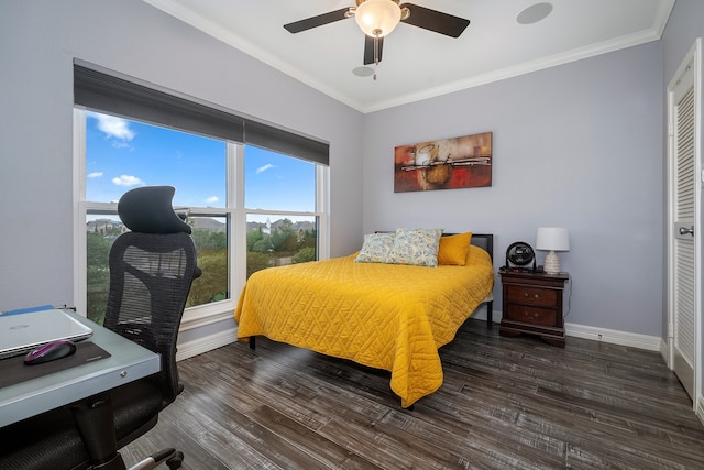 bedroom featuring ornamental molding, a closet, ceiling fan, and dark wood-type flooring