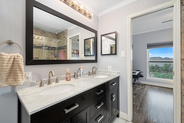 bathroom featuring a shower, vanity, wood-type flooring, and ornamental molding