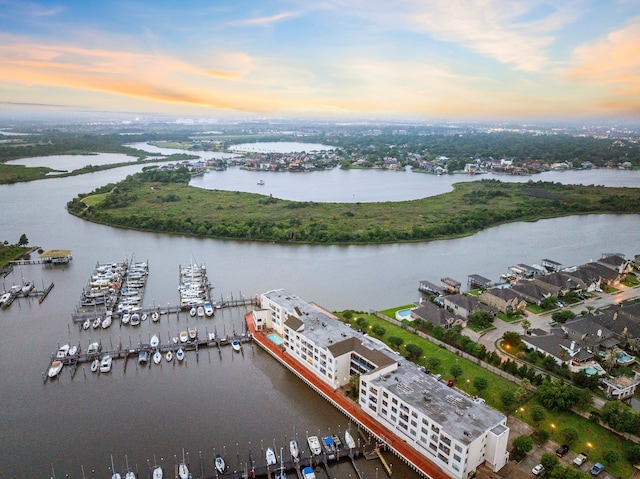 aerial view at dusk with a water view