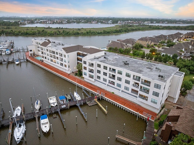 aerial view at dusk with a water view